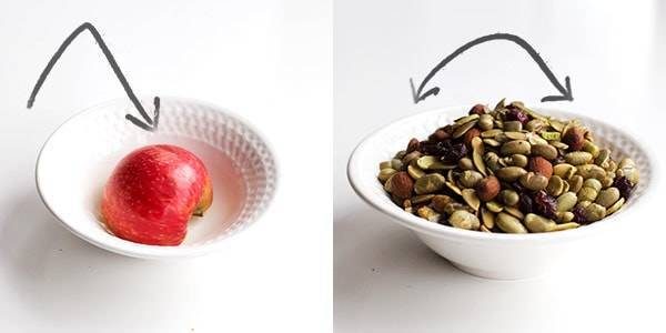 Apple in a bowl and seeds in a bowl.
